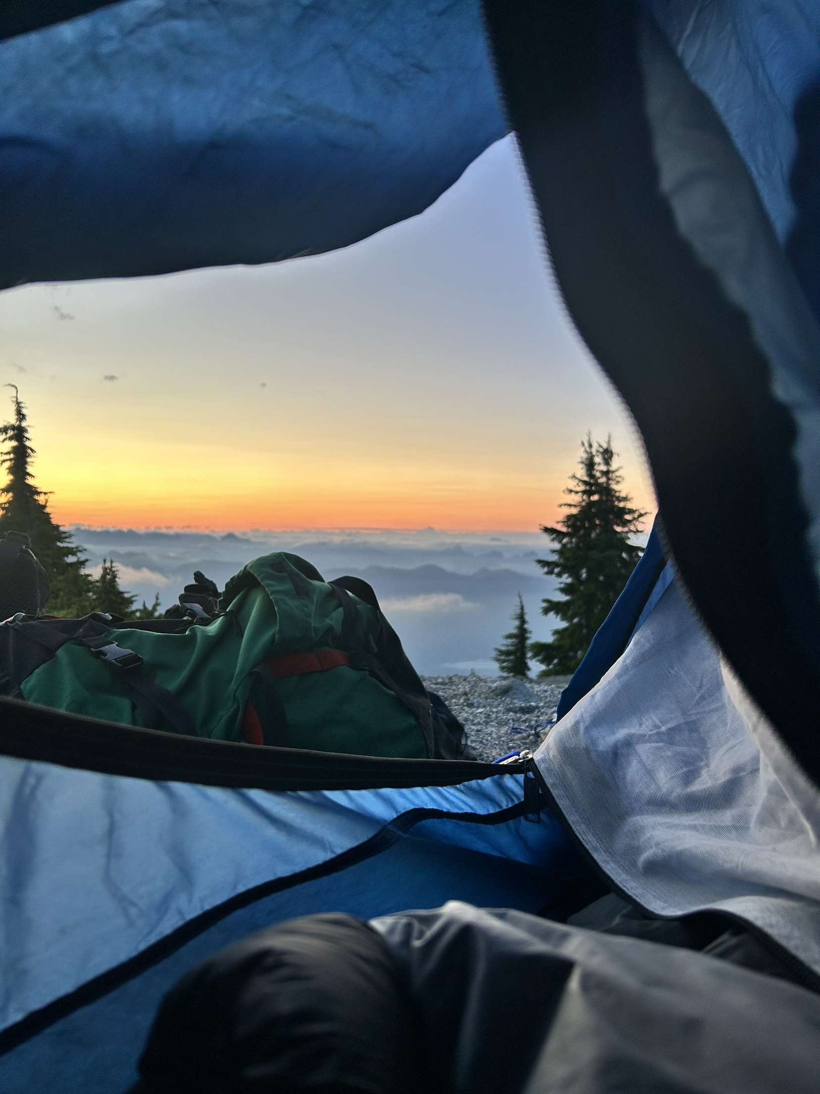 Sunrise over the mountains seen from inside Dylan's tent
