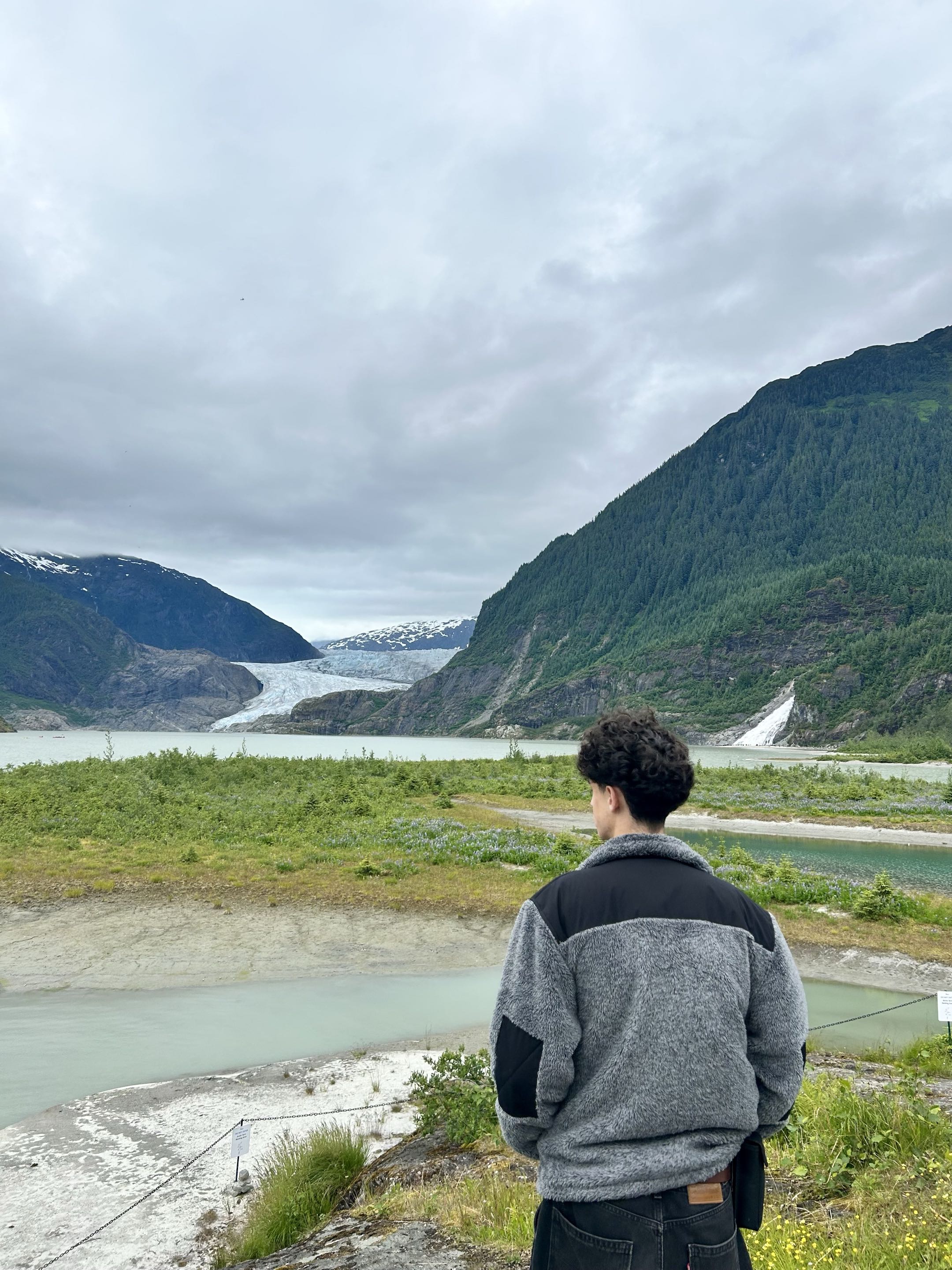 Dylan looking toward a glacier in Alaska
